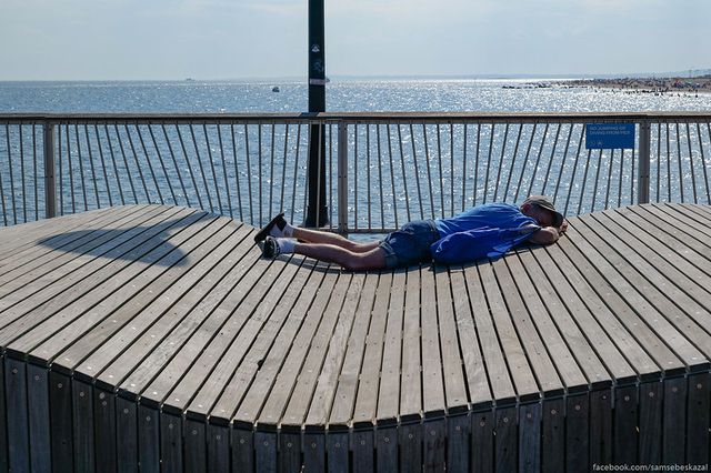 A photo of a person lounging in Coney Island